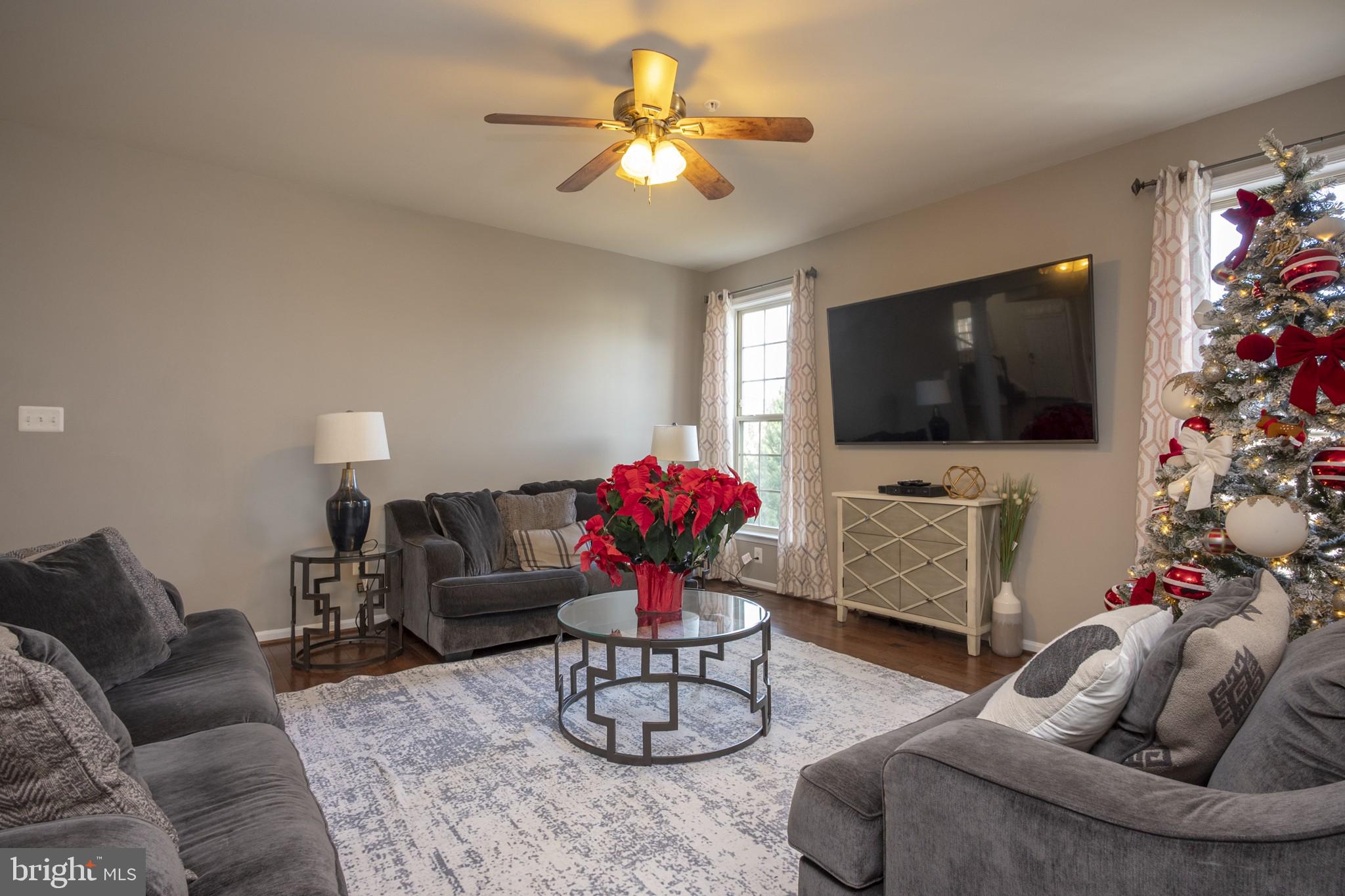 2703 Swann Wing Court Lanham, MD 20706 - Photo 13 of 36 a living room with furniture and a flat screen tv