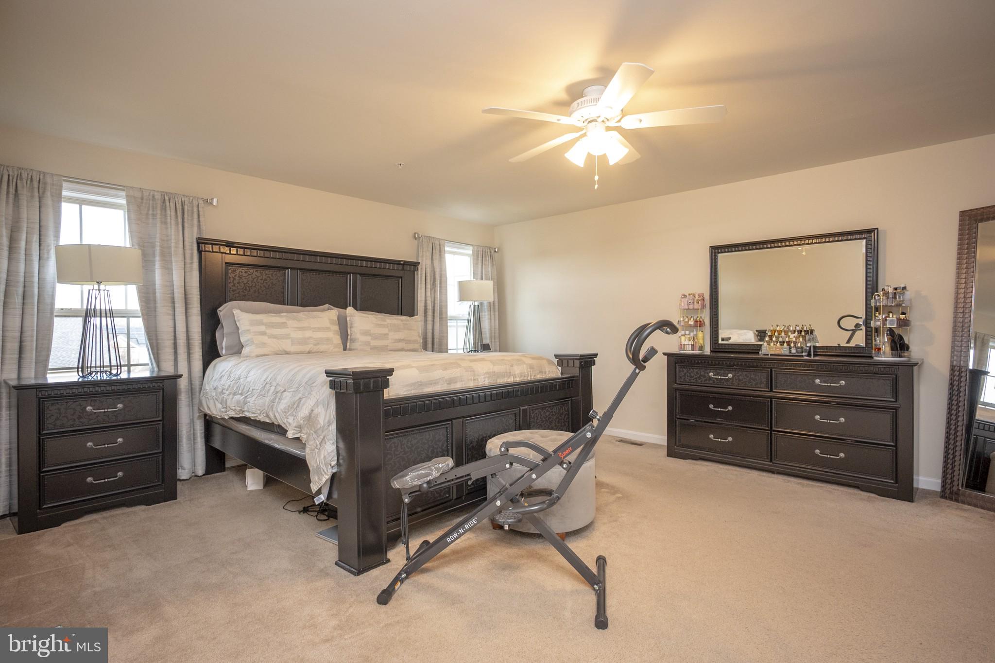 2703 Swann Wing Court Lanham, MD 20706 - Photo 21 of 36 a bedroom with a bed and a dresser
