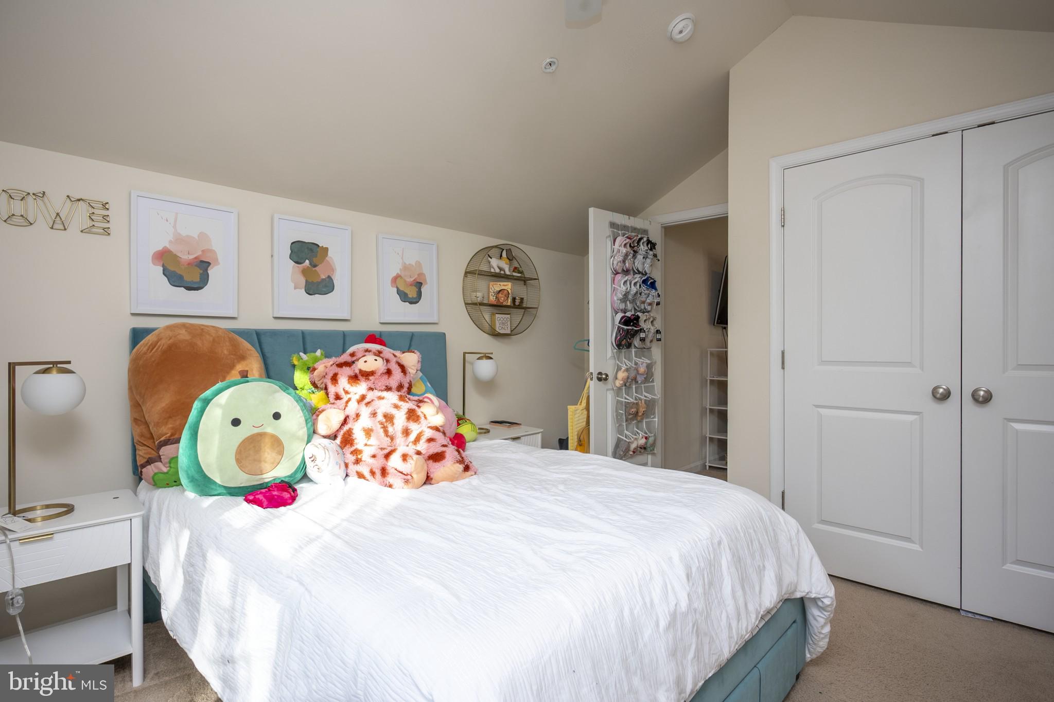 2703 Swann Wing Court Lanham, MD 20706 - Photo 26 of 36 a bedroom with a bed and a table