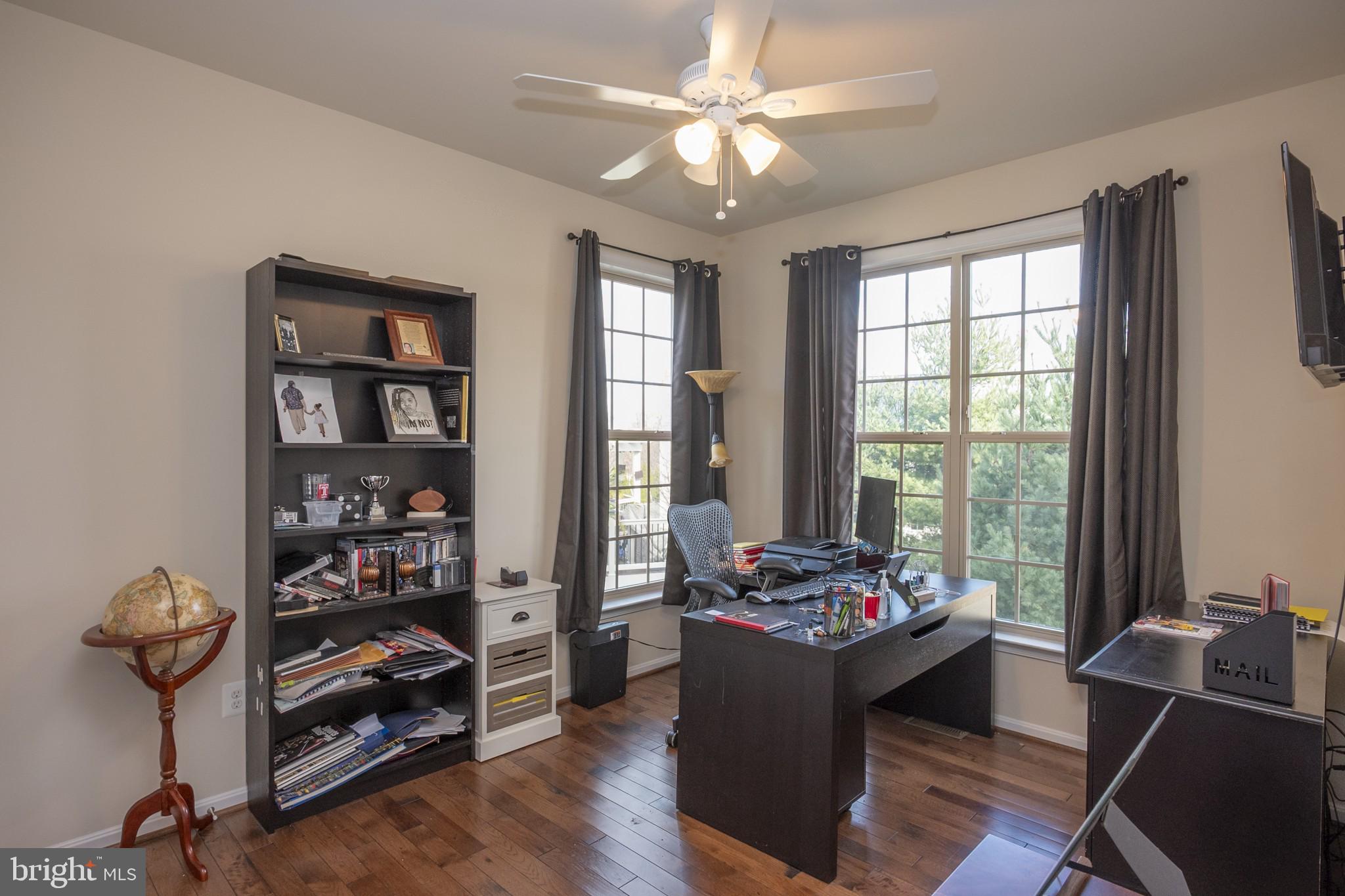 2703 Swann Wing Court Lanham, MD 20706 - Photo 10 of 36 a view of a workspace with furniture and a window