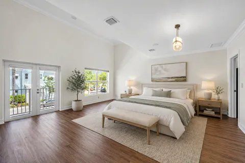 a bedroom with a large bed and a window