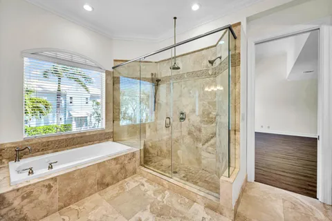 a bathroom with a bathtub and a shower