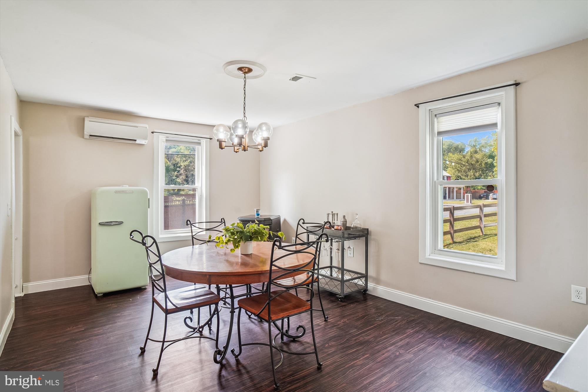 6230 Manor Woods Road Frederick, MD 21703 - Photo 15 of 35 a view of a dining room with furniture window and wooden floor