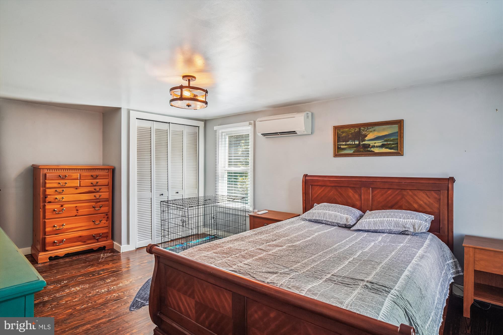 6230 Manor Woods Road Frederick, MD 21703 - Photo 18 of 35 a bedroom with a bed and wooden floor