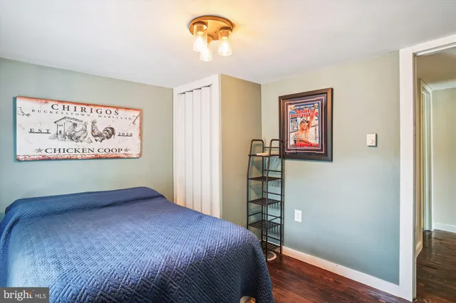 a bedroom with a bed and a bookshelf