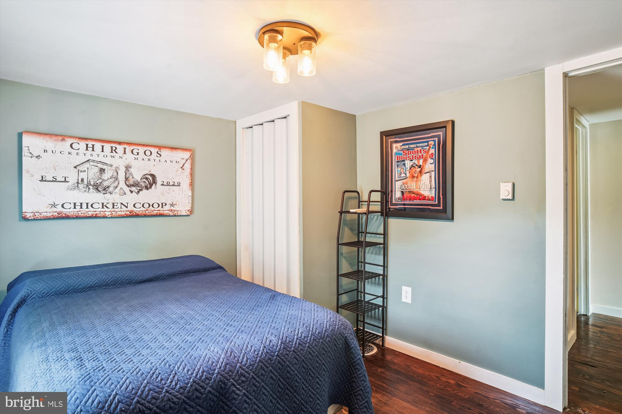 6230 Manor Woods Road Frederick, MD 21703 - Photo 23 of 35 a bedroom with a bed and a bookshelf