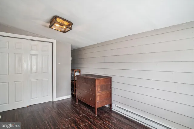 a view of a house with backyard porch and sitting area