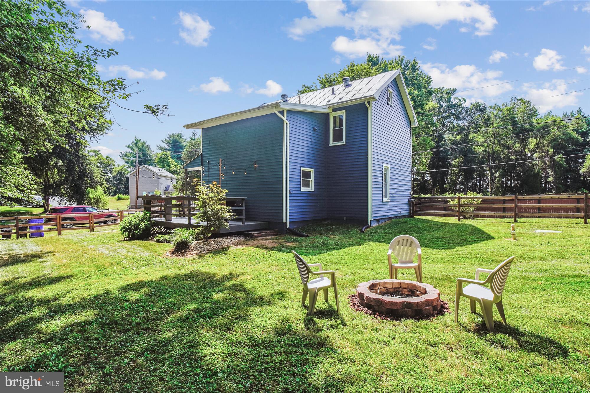 6230 Manor Woods Road Frederick, MD 21703 - Photo 29 of 35 a view of a house with backyard porch and sitting area