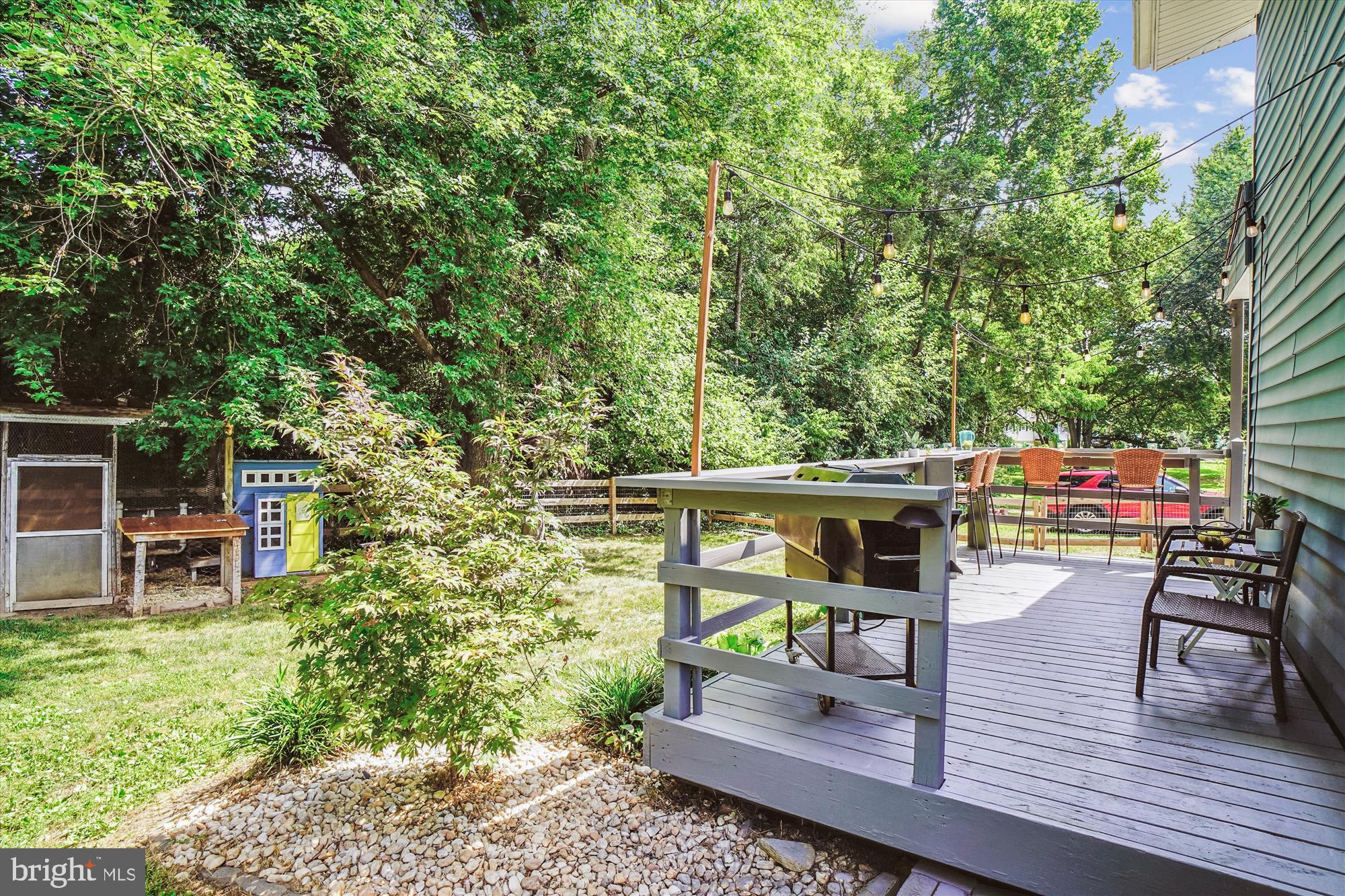 6230 Manor Woods Road Frederick, MD 21703 - Photo 32 of 35 a view of a chairs and table on the wooden deck