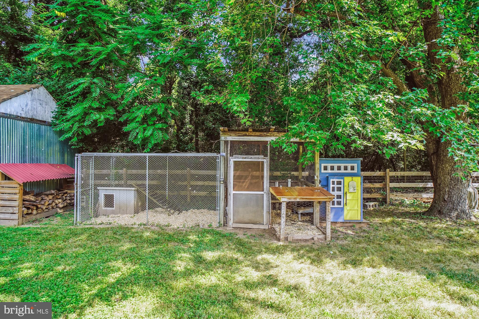 6230 Manor Woods Road Frederick, MD 21703 - Photo 35 of 35 a backyard of a house with table and chairs