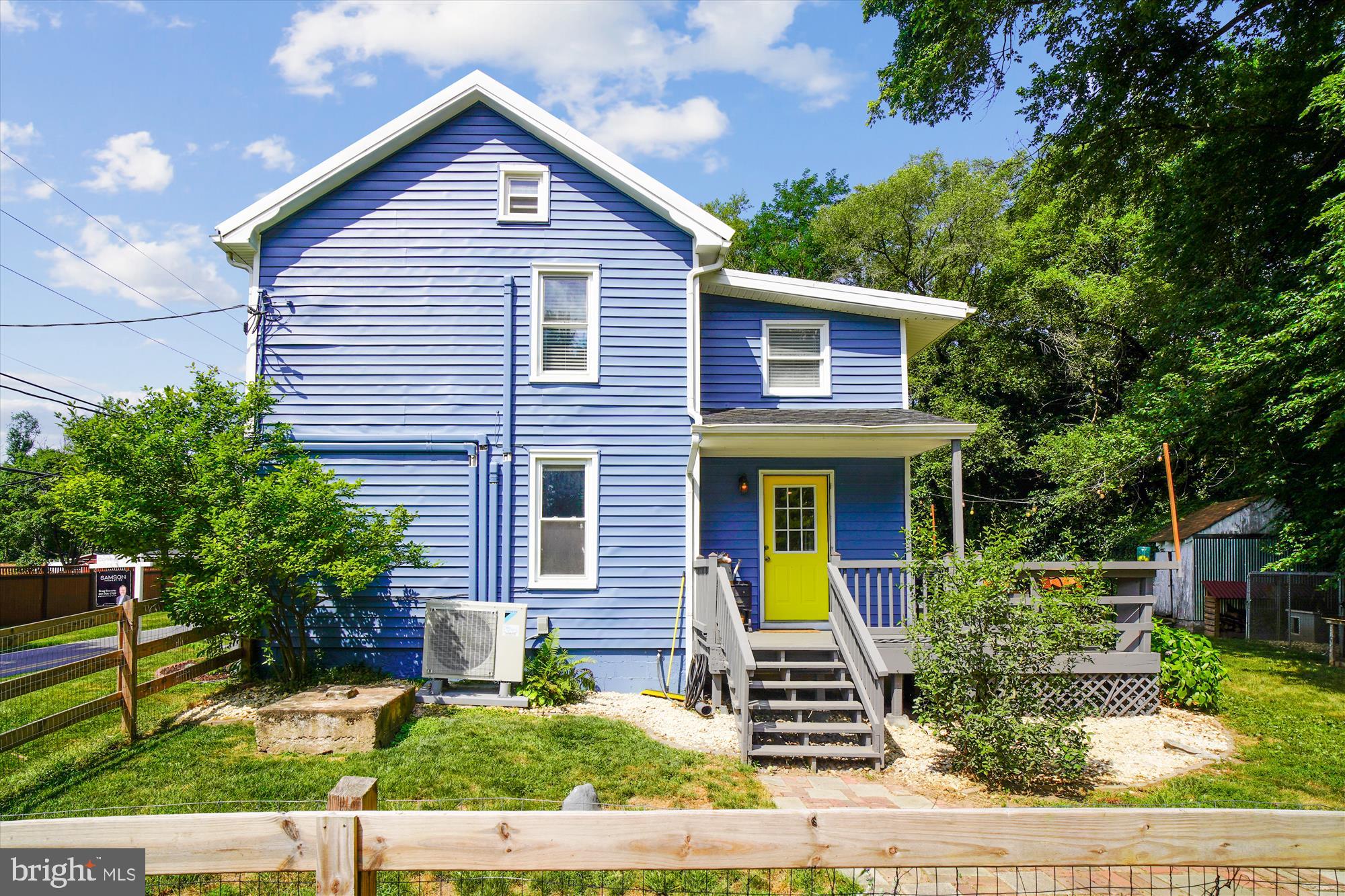 6230 Manor Woods Road Frederick, MD 21703 - Photo 4 of 35 a front view of a house with garden