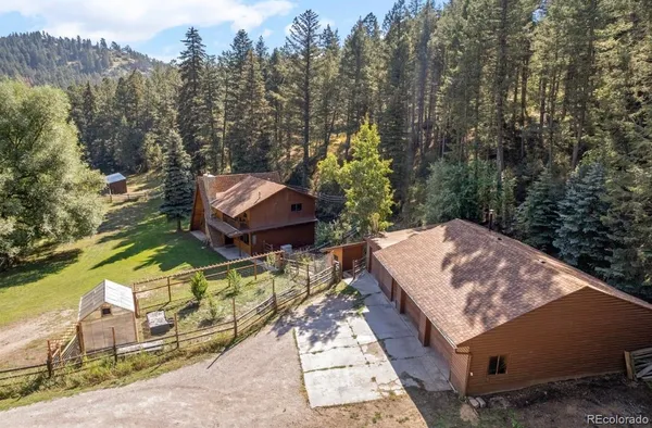 a view of a backyard with sitting area