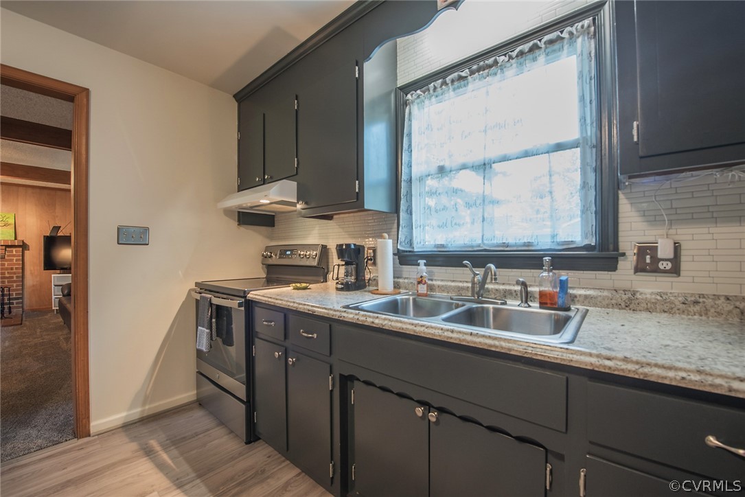 15501 Saddlebrook Road Chesterfield, VA 23838 - Photo 16 of 44 a kitchen with a sink cabinets and a window