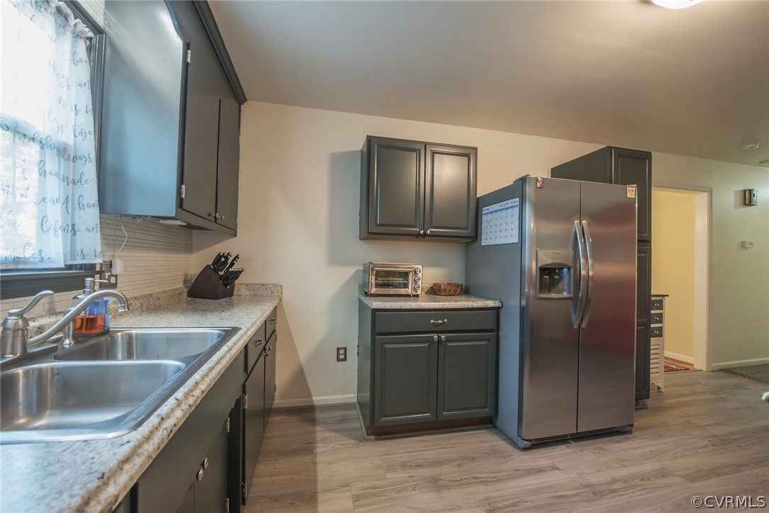 15501 Saddlebrook Road Chesterfield, VA 23838 - Photo 18 of 44 a kitchen with stainless steel appliances granite countertop a sink stove and refrigerator