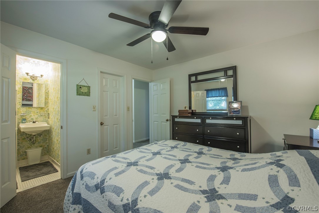 15501 Saddlebrook Road Chesterfield, VA 23838 - Photo 30 of 44 a bedroom with a bed and a chandelier