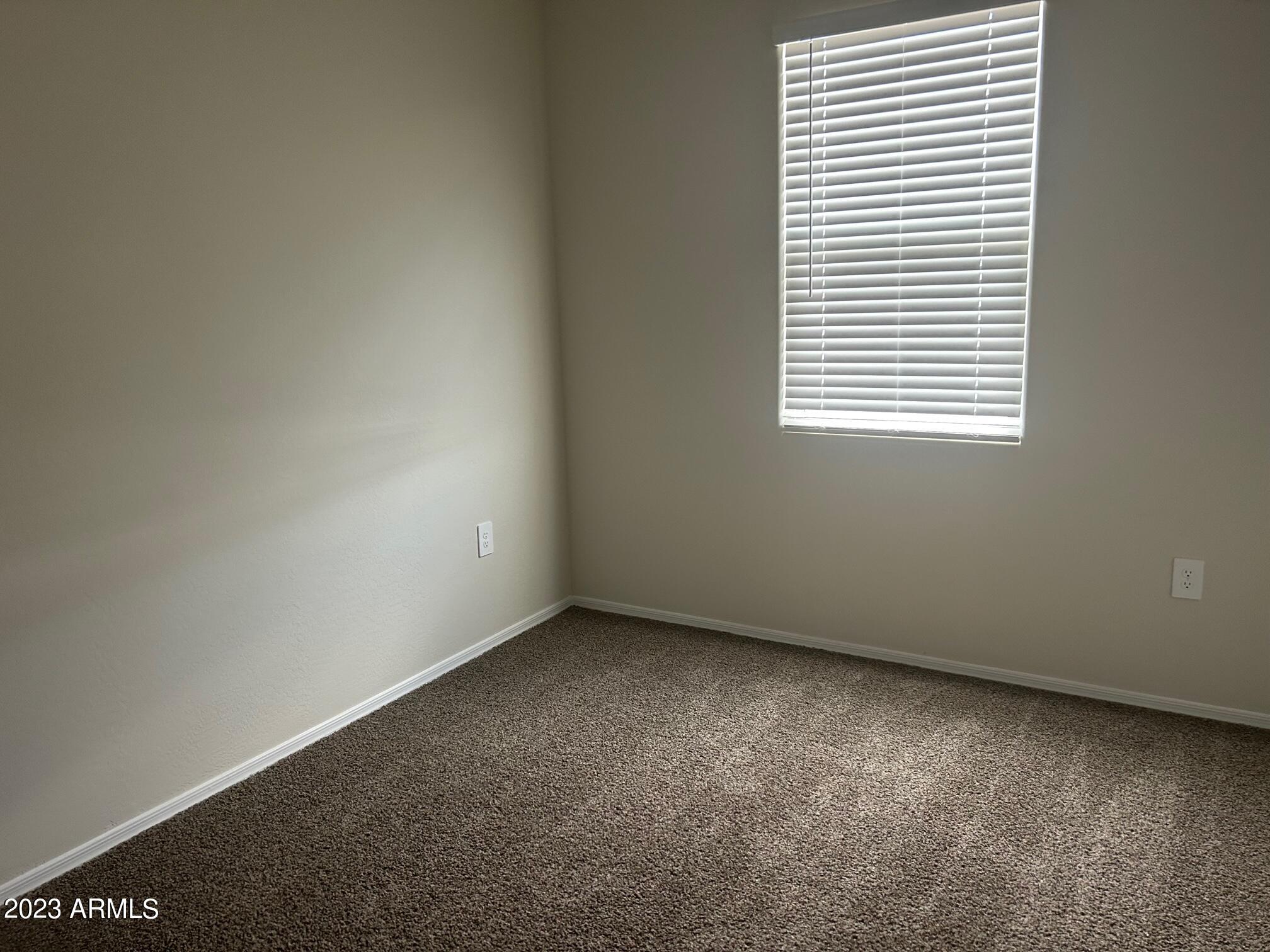 5119 East Emery Road San Tan Valley, AZ 85143 - Photo 13 of 19 an empty room with a window