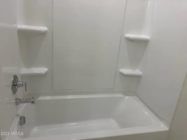 a close view of a bathtub in bathroom