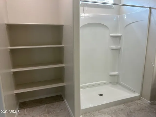 a bathroom with a bath tub and a shower