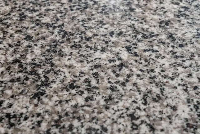 a close up of a white marble wall