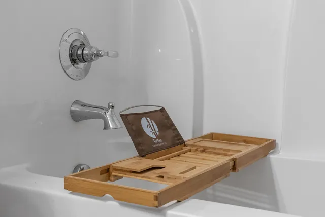 a bedroom with a bed next to a window