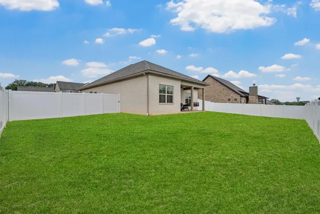 a front view of a house with a yard and porch