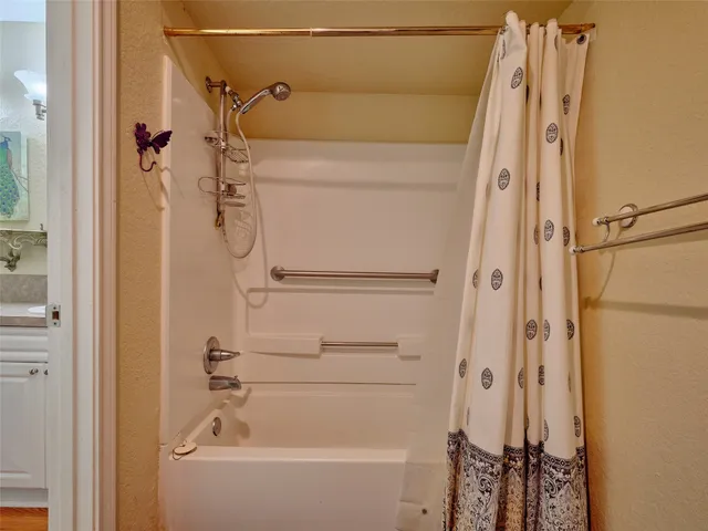 a view of a bedroom and bathroom