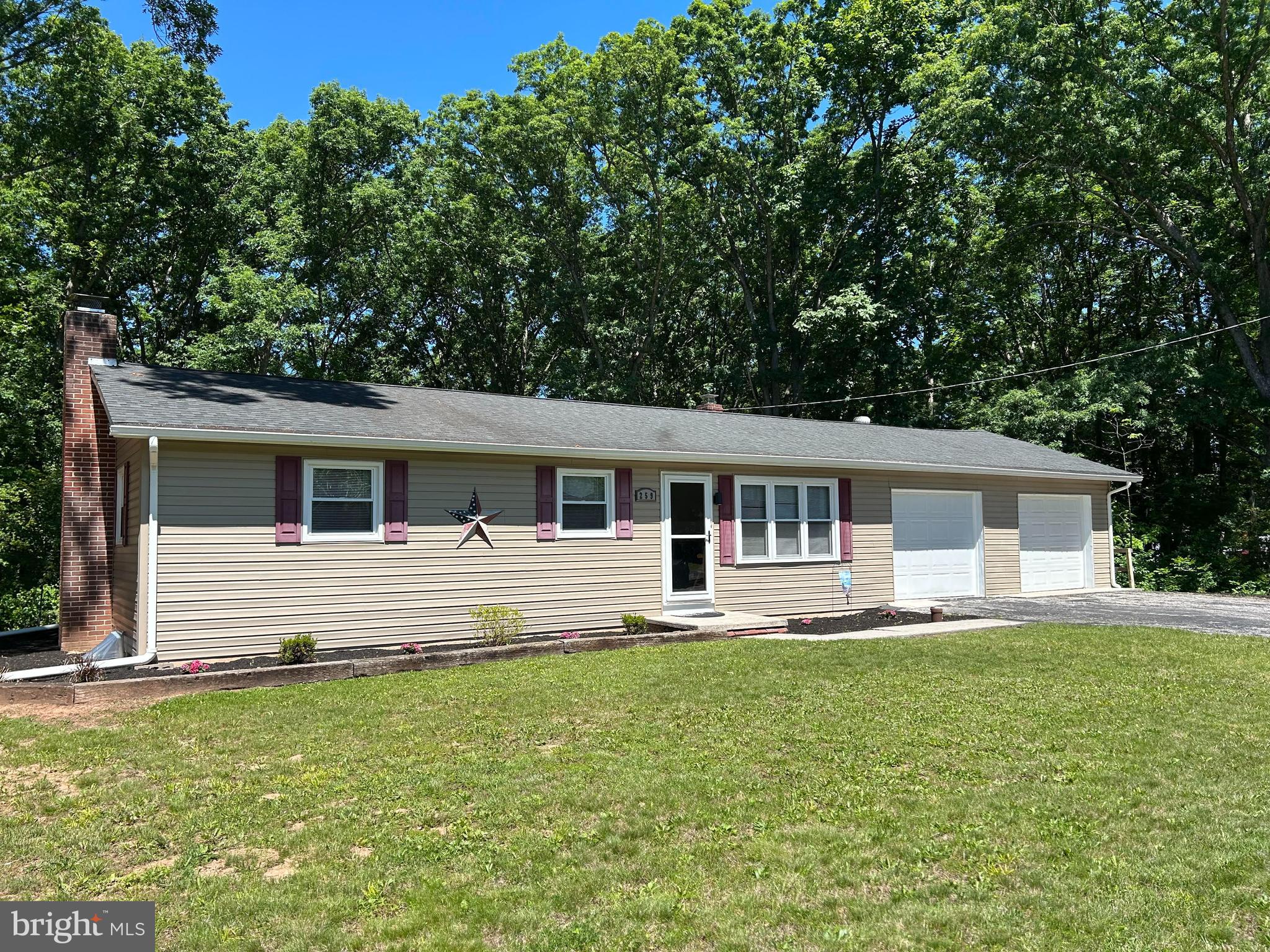 259 Hoffman Road Gettysburg, PA 17325 - Photo 1 of 23 a front view of house with yard and seating area