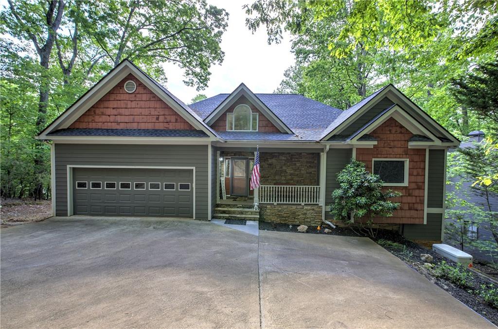 181 Fox Den Circle Jasper, GA 30143 - Photo 3 of 111 a front view of a house with garden