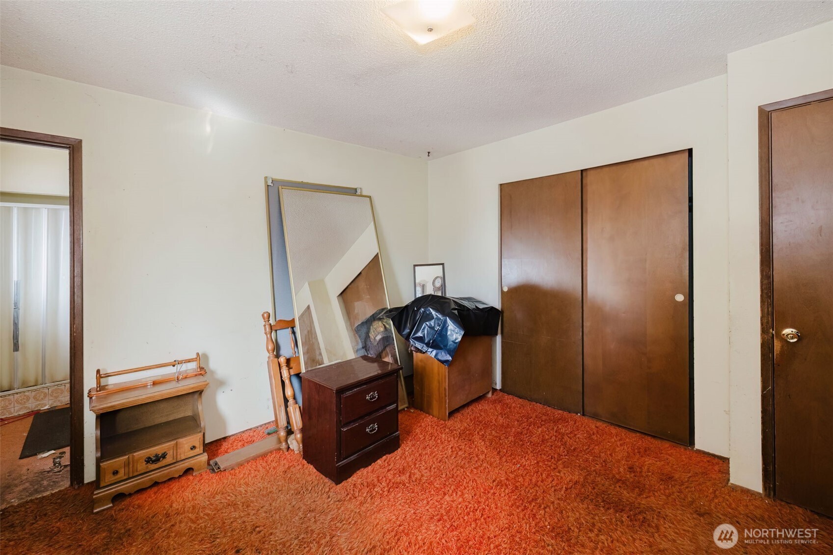 567 Juniper Street Bremerton, WA 98310 - Photo 14 of 37 a bed room with furniture and a mirror