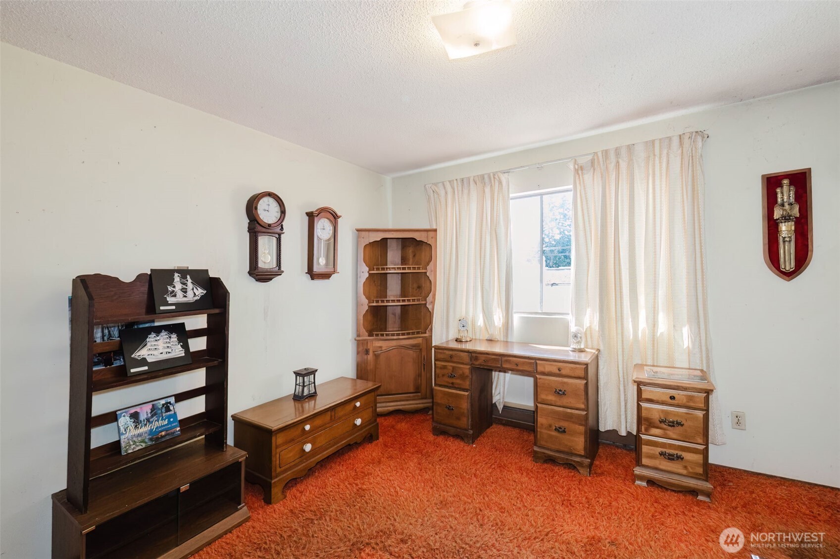 567 Juniper Street Bremerton, WA 98310 - Photo 15 of 37 a living room with furniture cabinets and a window