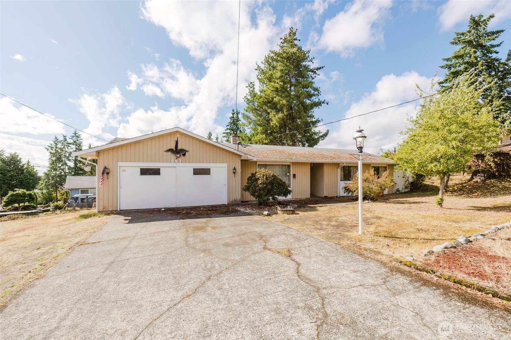 567 Juniper Street Bremerton, WA 98310 - Photo 2 of 37 a view of a house with a yard covered in snow