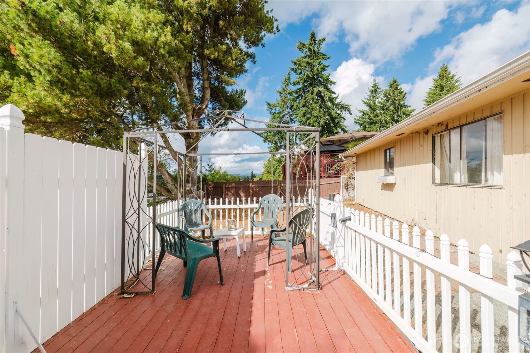 567 Juniper Street Bremerton, WA 98310 - Photo 21 of 37 a view of a deck with furniture and wooden floor
