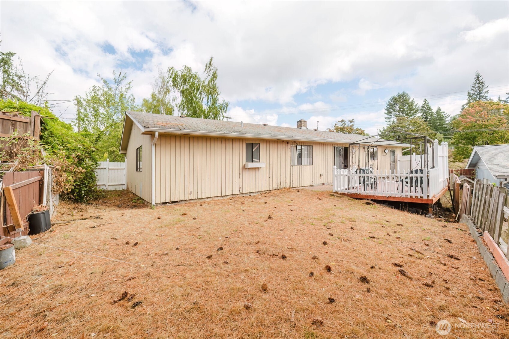567 Juniper Street Bremerton, WA 98310 - Photo 24 of 37 a view of a house with a wooden fence