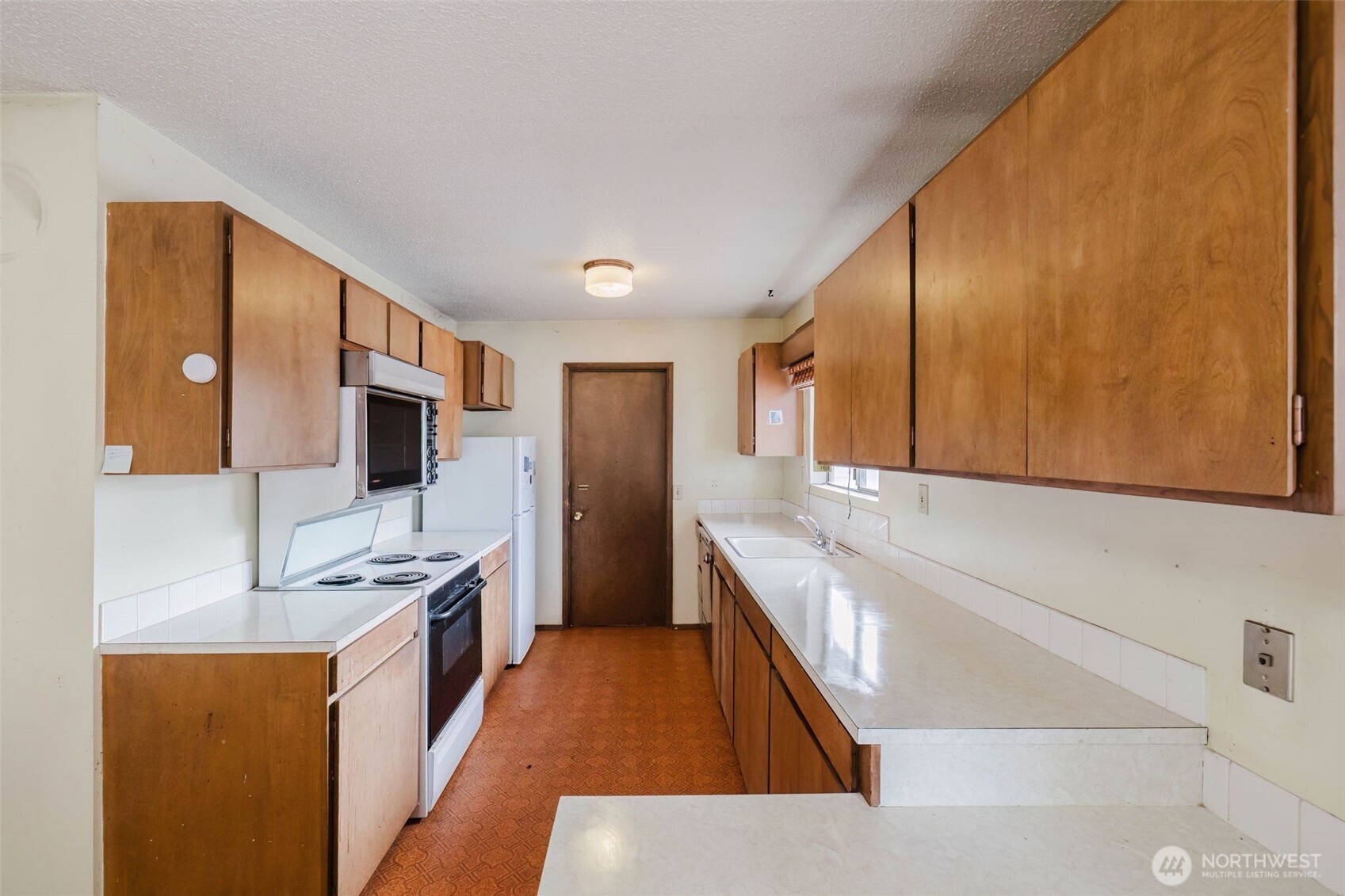 567 Juniper Street Bremerton, WA 98310 - Photo 5 of 37 a kitchen with stainless steel appliances granite countertop a sink stove and refrigerator