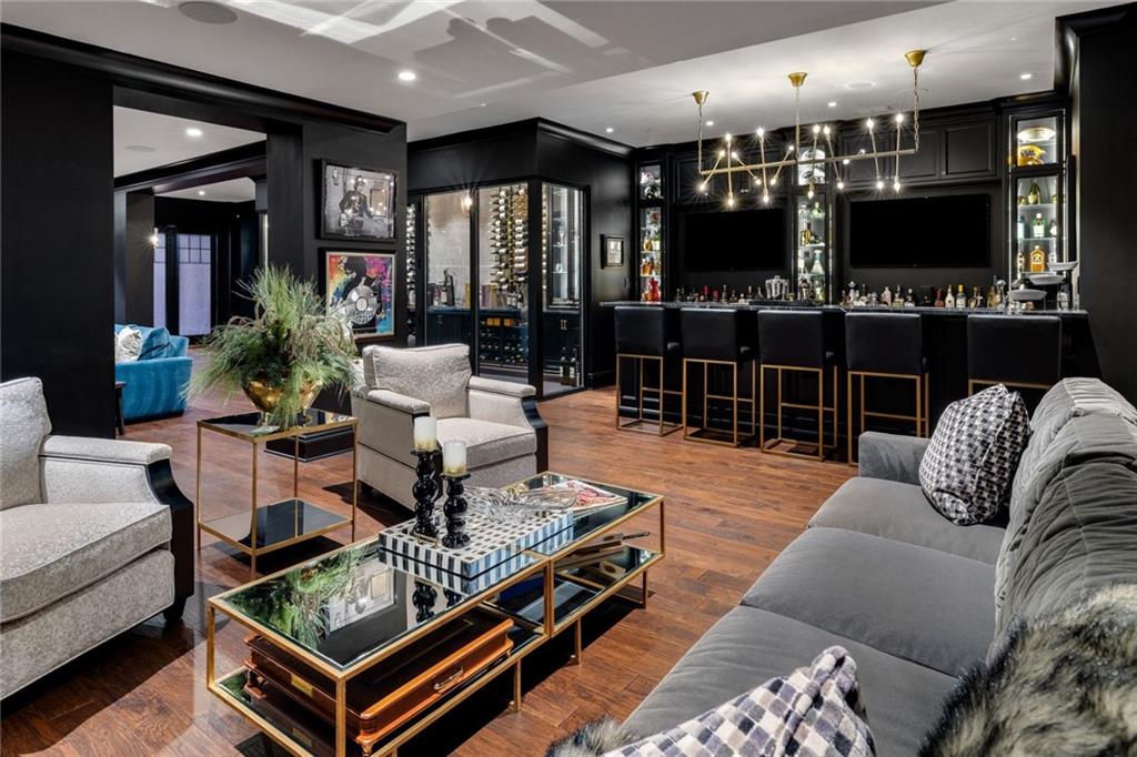 435 Myoma Road Mars, PA 16046 - Photo 31 of 50 Designer bar and lounge with dark custom cabinetry, generous seating and a seamless setting for hosting.