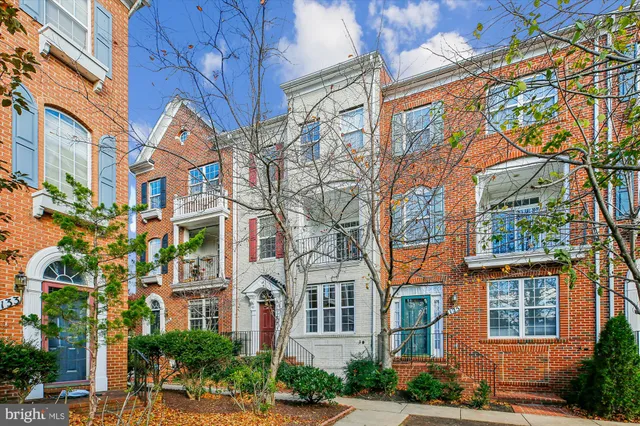 a view of a brick building next to a road