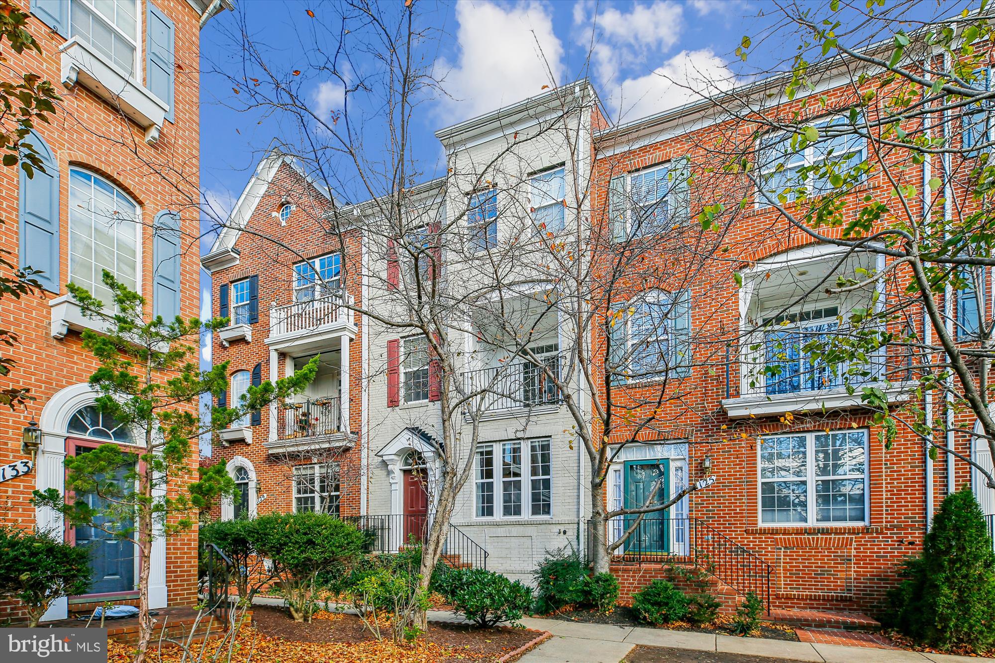 a view of a brick building next to a road