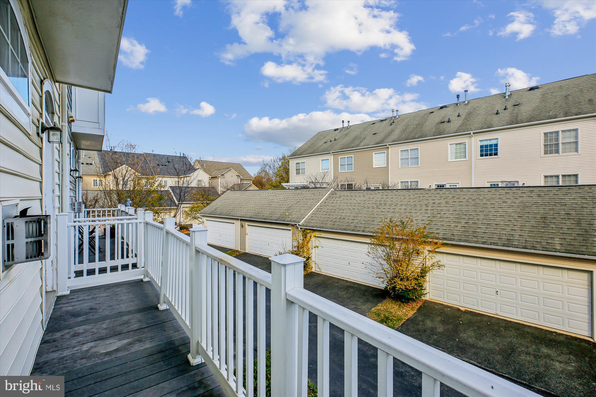 1127 Gaither Road Rockville, MD 20850 - Photo 14 of 36 a view of a house with wooden deck
