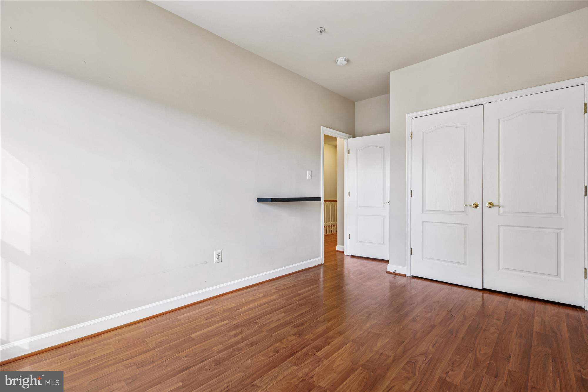 1127 Gaither Road Rockville, MD 20850 - Photo 18 of 36 a view of an empty room with wooden floor