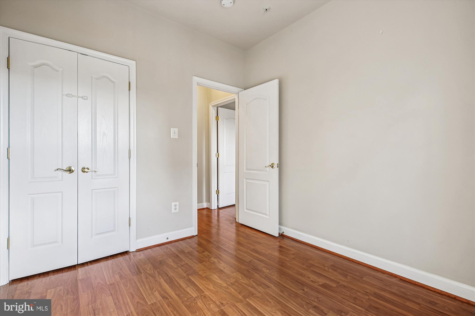 1127 Gaither Road Rockville, MD 20850 - Photo 23 of 36 a view of an empty room with wooden floor