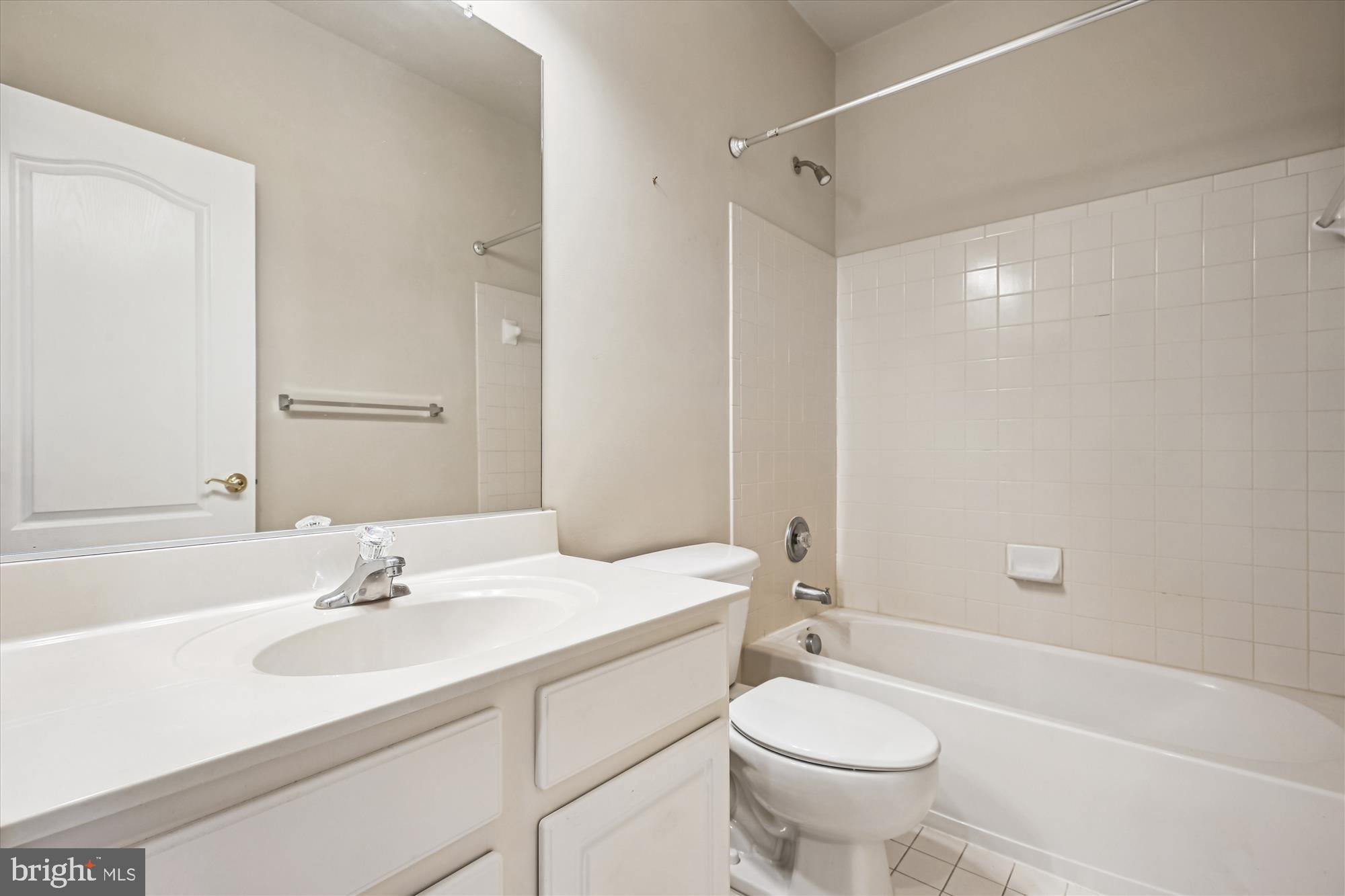 1127 Gaither Road Rockville, MD 20850 - Photo 24 of 36 a bathroom with a sink toilet tub and shower