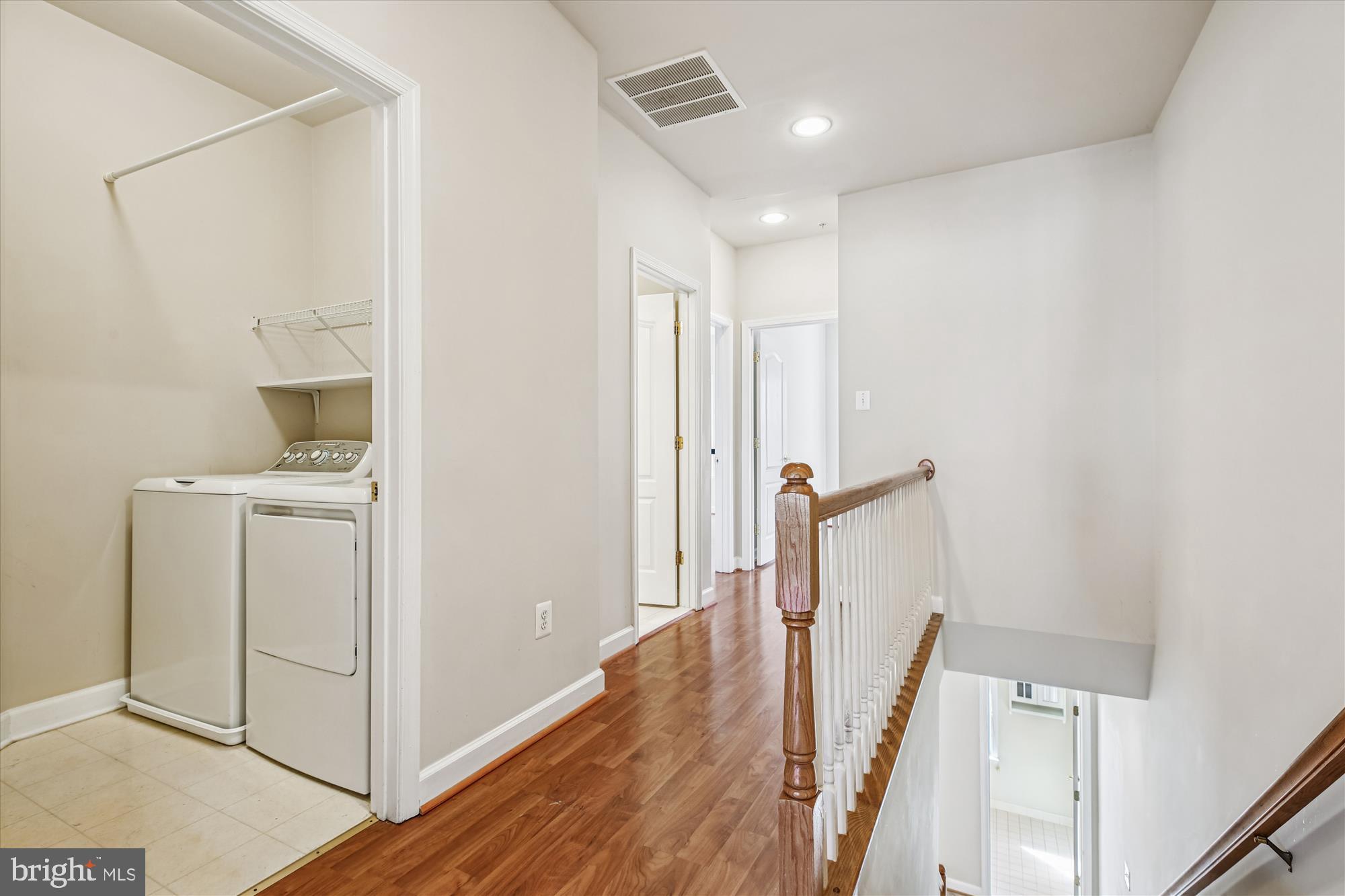 1127 Gaither Road Rockville, MD 20850 - Photo 25 of 36 a view of a hallway with wooden floor and entryway