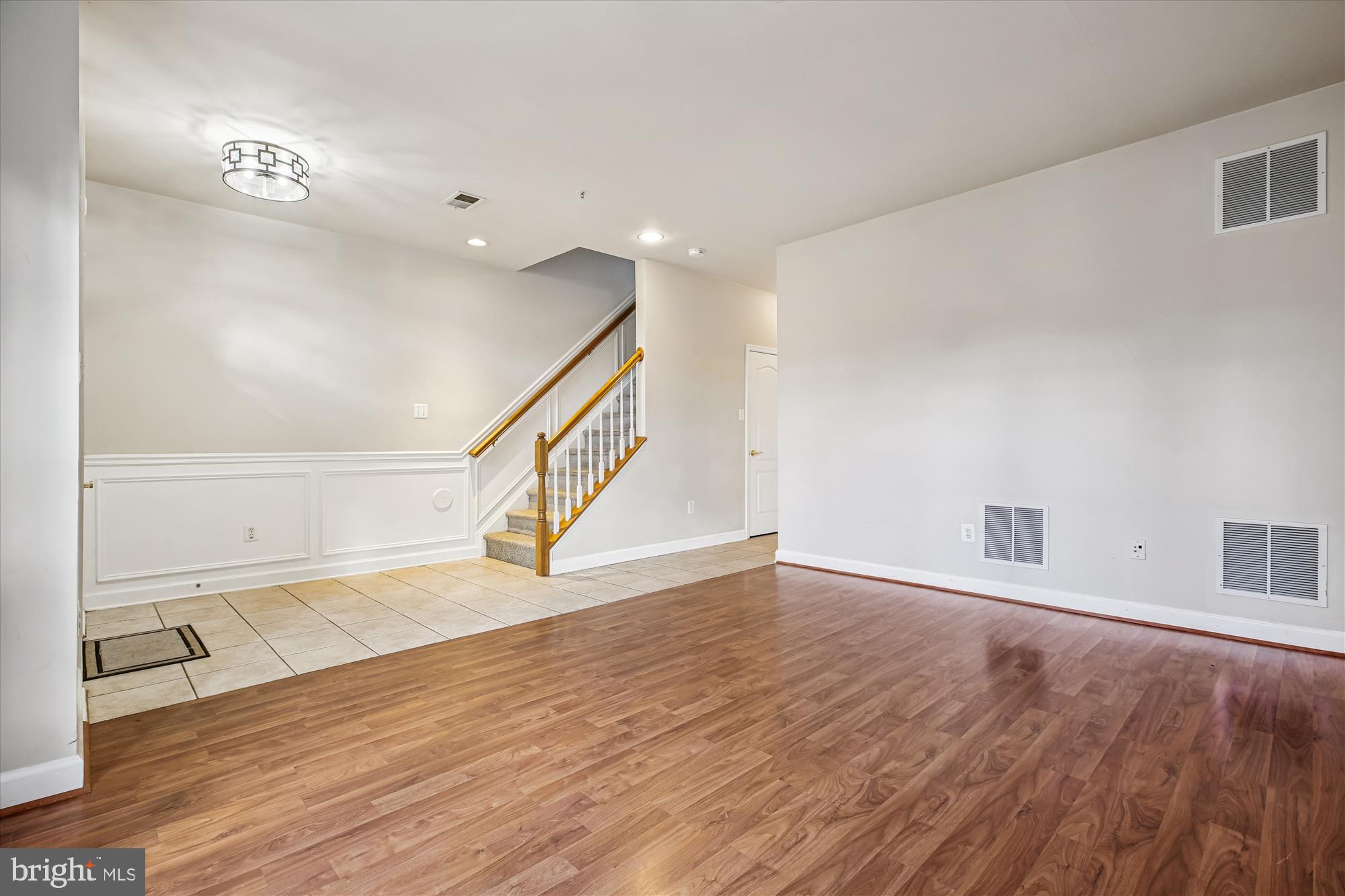 1127 Gaither Road Rockville, MD 20850 - Photo 26 of 36 a view of an empty room with wooden floor