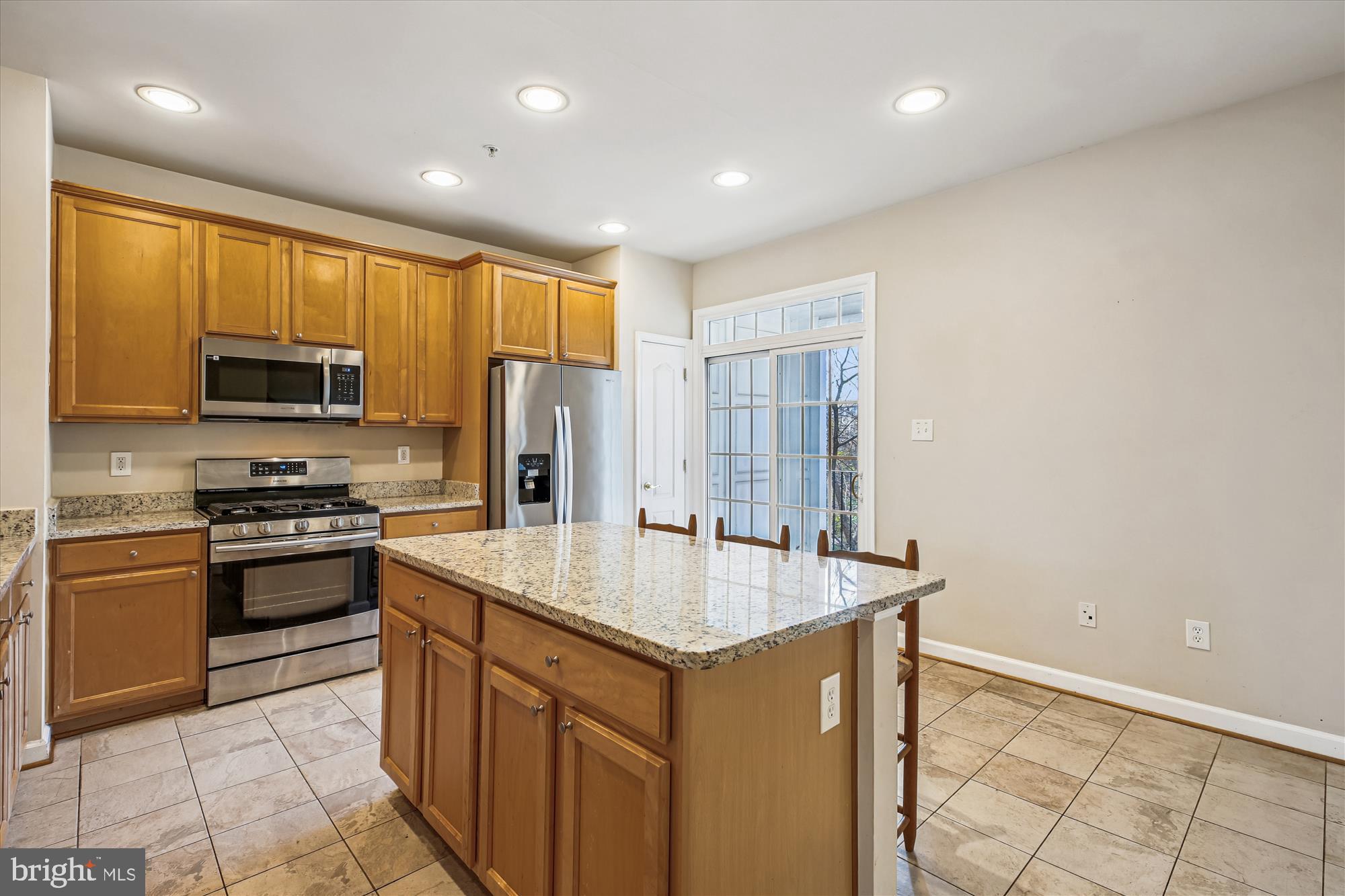 1127 Gaither Road Rockville, MD 20850 - Photo 6 of 36 a kitchen with stainless steel appliances granite countertop a sink stove and refrigerator