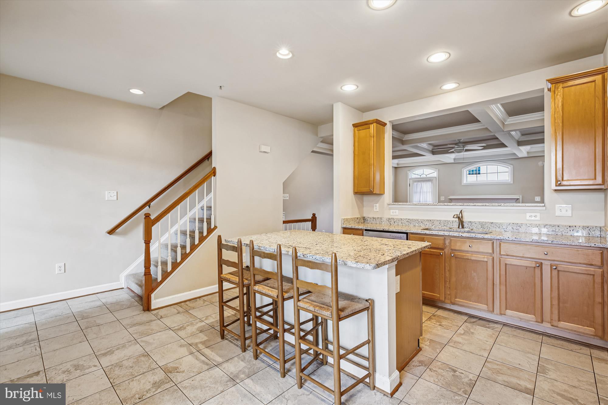 1127 Gaither Road Rockville, MD 20850 - Photo 8 of 36 a kitchen with granite countertop sink window and chairs