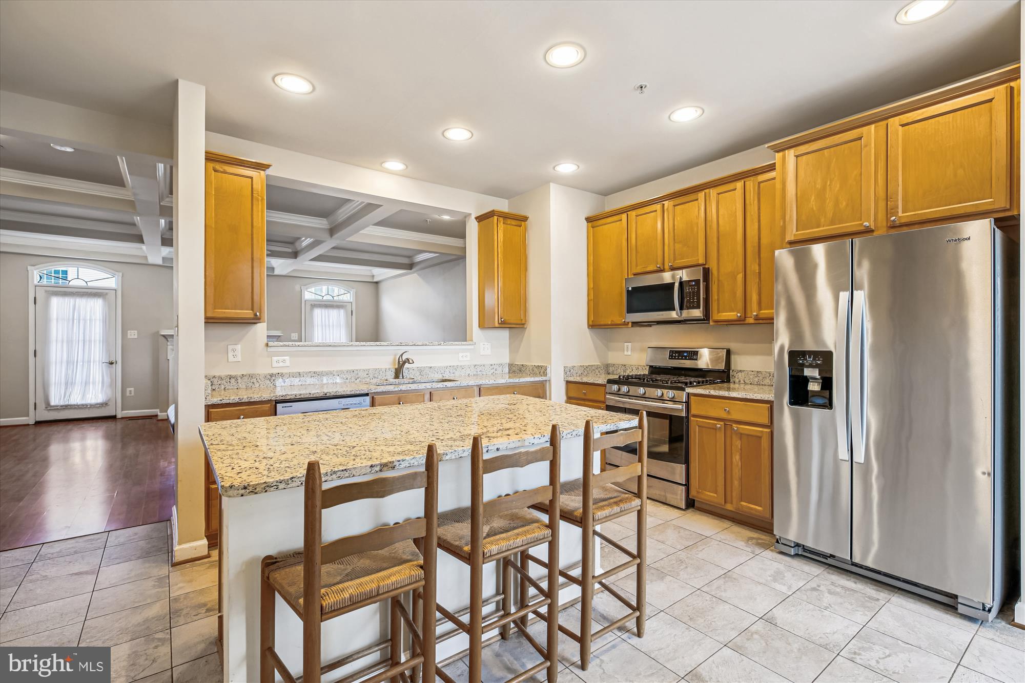 1127 Gaither Road Rockville, MD 20850 - Photo 9 of 36 a kitchen with granite countertop a refrigerator stove microwave and sink