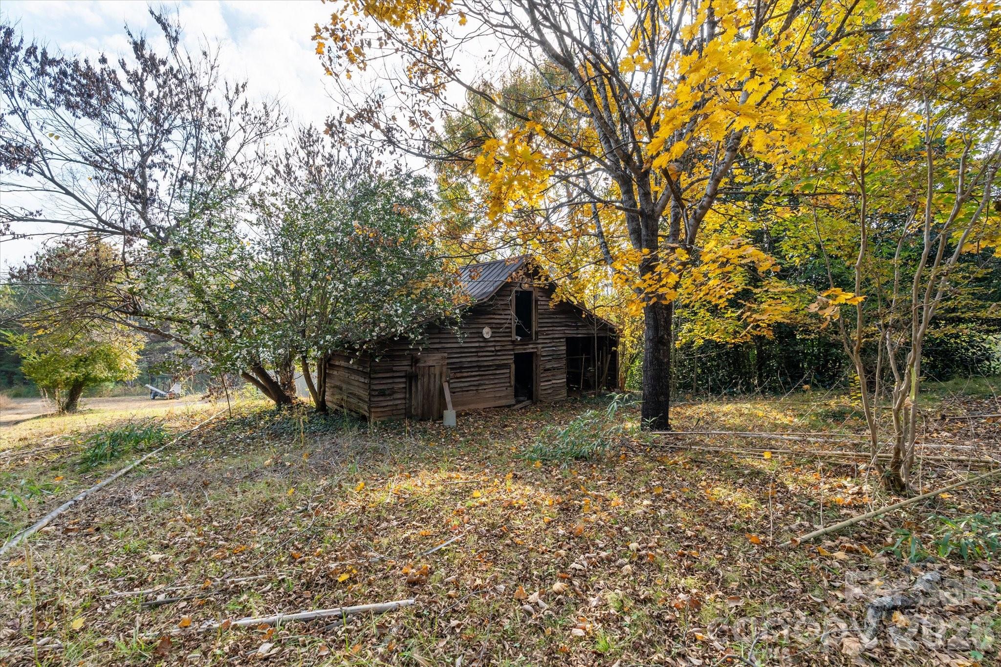 1888 Pea Ridge Road Mill Spring, NC 28756 - Photo 20 of 31 a house view with a backyard space