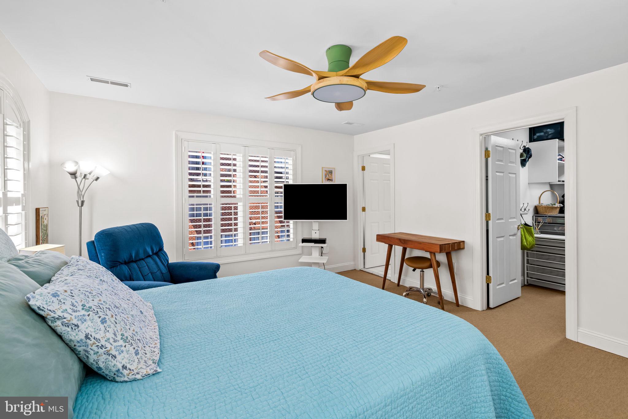 2331 Boston Street, Unit 1 Baltimore, MD 21224 - Photo 46 of 74 a bedroom with a bed and a flat screen tv