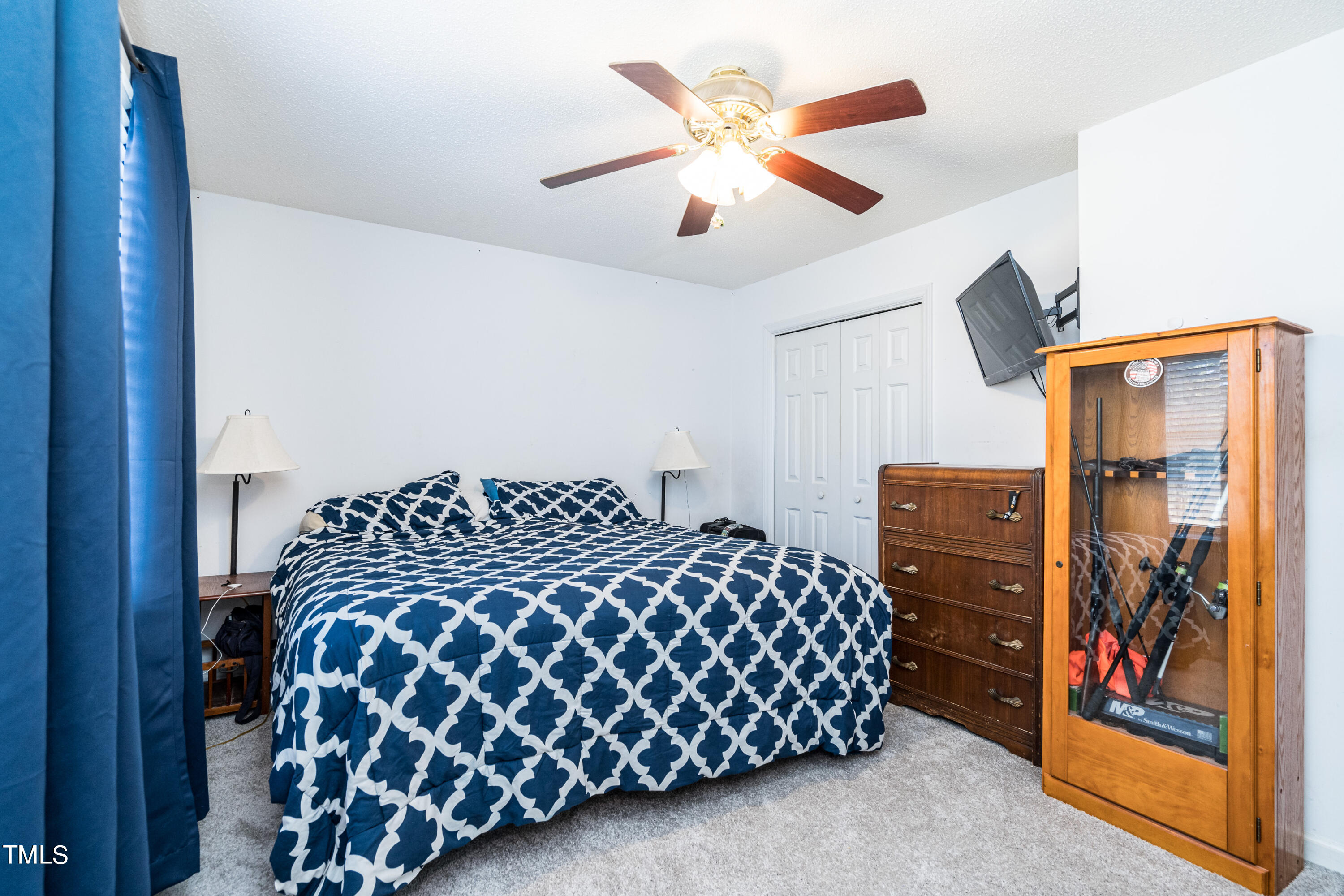 429 Government Road Clayton, NC 27520 - Photo 16 of 27 a bedroom with a bed and dresser
