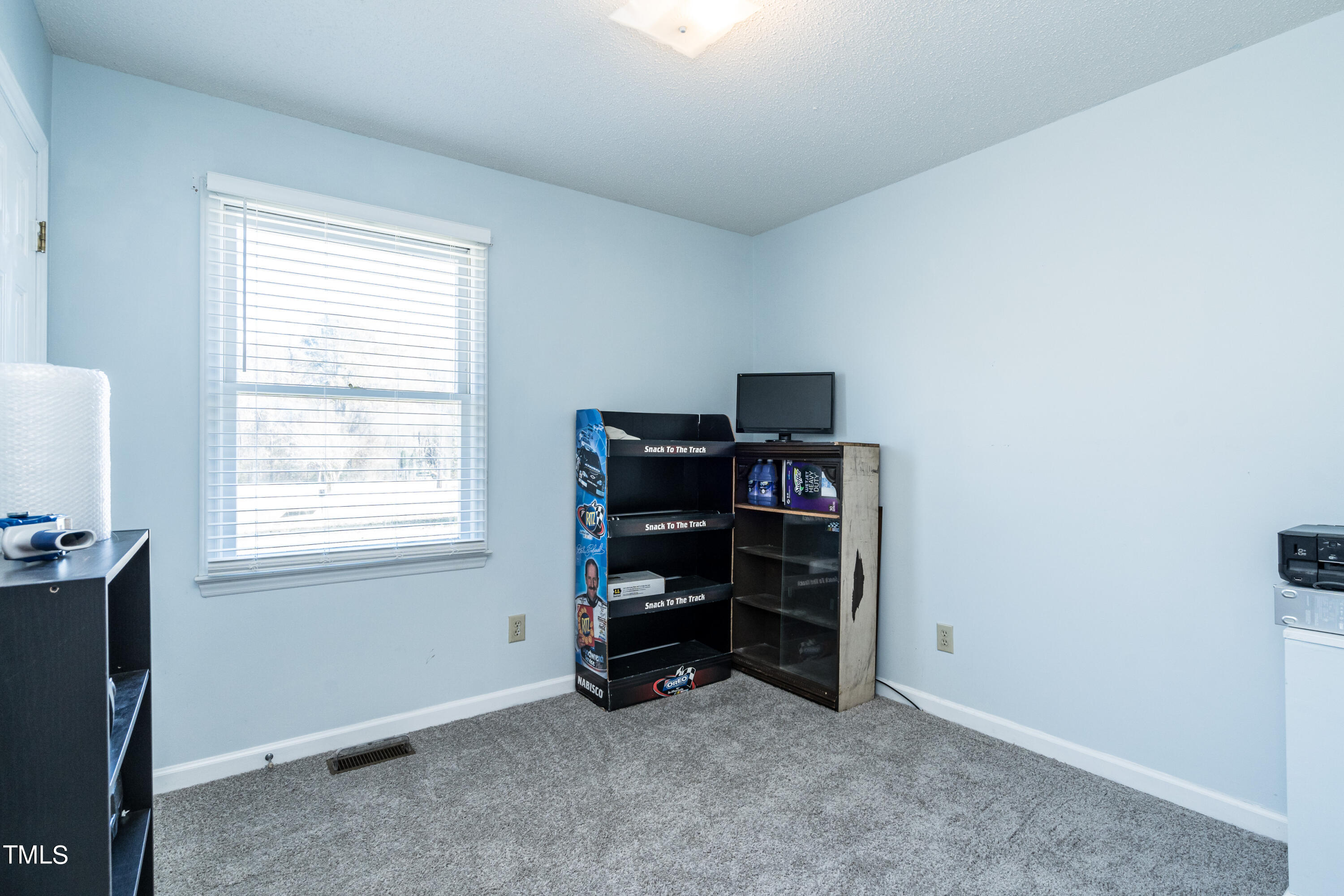 429 Government Road Clayton, NC 27520 - Photo 20 of 27 a view of room with workspace and windows